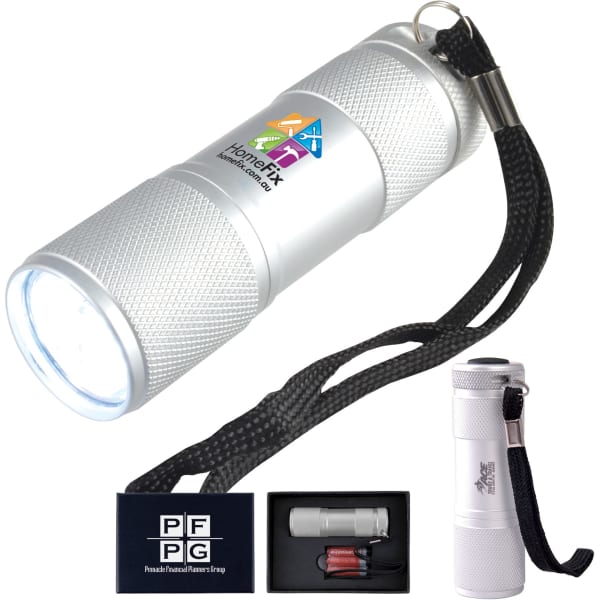 A silver laser torch with a textured grip and a keyring attachment, presented in a black box.