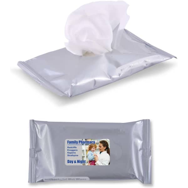 A pack of silver antibacterial wet wipes with a white wipe partially out. It features a logo on the front.