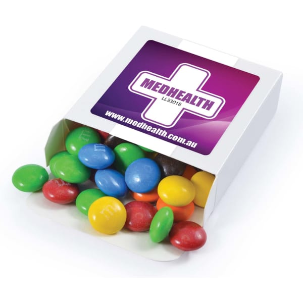 A box of M&M's containing colourful chocolate beans, including red, blue, green, yellow, and brown. The box has a logo.