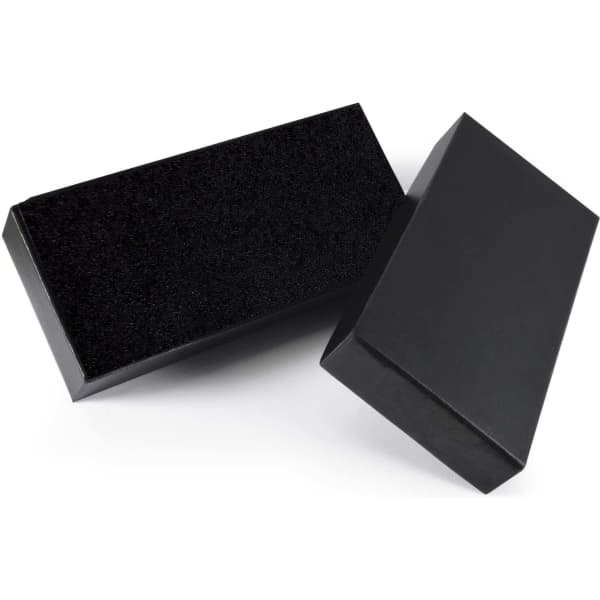A black gift box with a textured lid, paired with a sleek, smooth base, ideal for packaging.