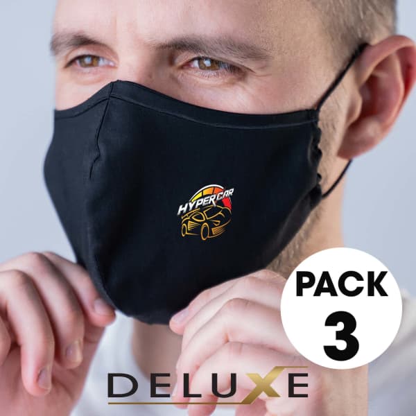 A black deluxe face mask with a logo, modelled by a person, featured in a three-pack set.