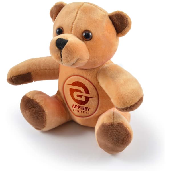 A plush teddy bear in shades of brown with a round face and button eyes. It features a logo on its chest.