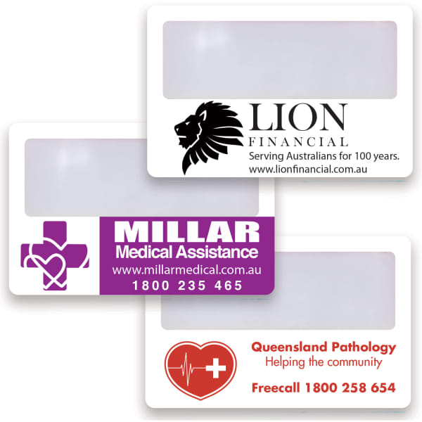 A collection of three plastic credit card magnifiers featuring various logos and medical-themed designs in white and purple.