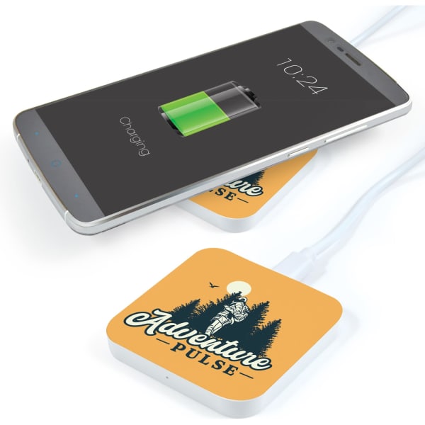 A square wireless charger in orange with a logo, placed under a smartphone showing a charging battery icon.