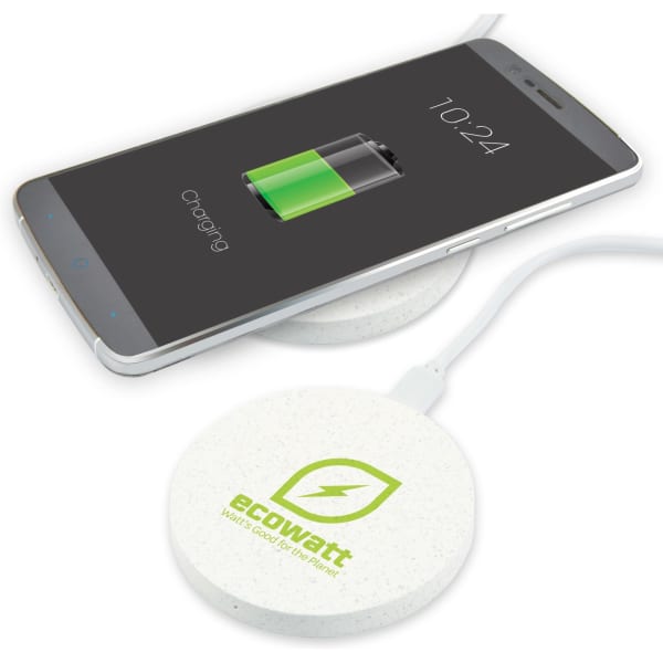 A round, white wireless charger with a green logo and a smartphone displaying a charging battery icon on top.