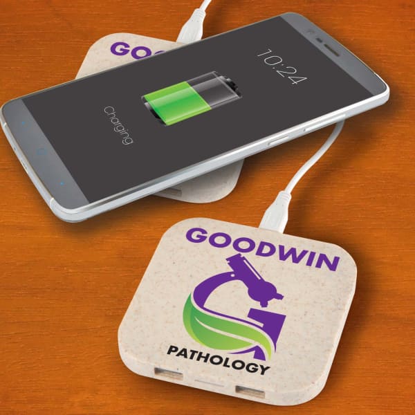 A wireless charger hub in cream colour with a logo, beside a smartphone displaying a charging battery icon.