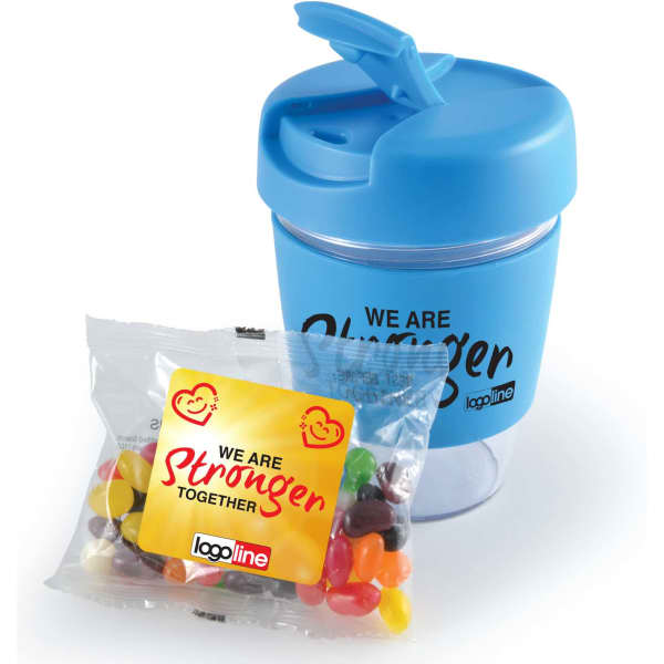 A blue reusable coffee cup with a lid and a packet of jelly beans featuring various colours. The cup has a logo.