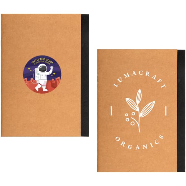 A brown A5 notebook featuring a space-themed sticker on one side and a botanical design on the other, with black binding.