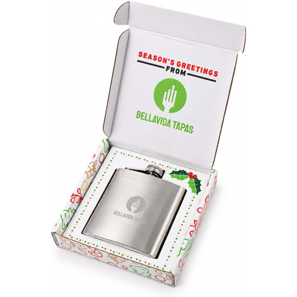 A stainless steel hip flask in a festive gift box, featuring a logo and decorated with a seasonal design.