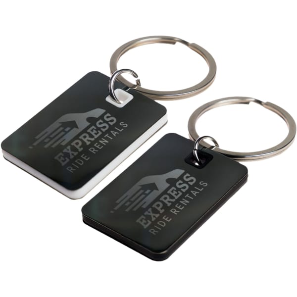 A black and white rectangular stainless steel keytag with a keyring, featuring a logo.