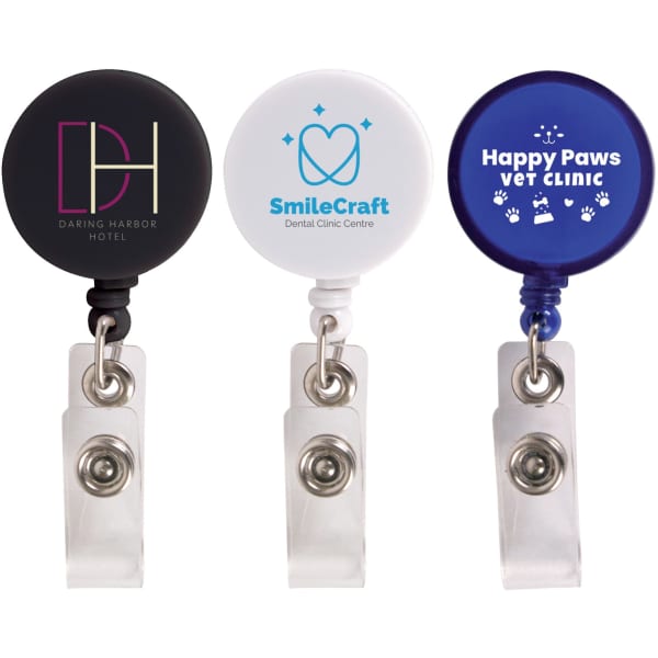 A set of three retractable name badge holders in black, white, and blue, each featuring a different logo.