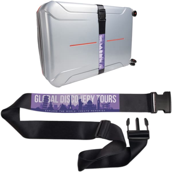 A silver suitcase with a black promotional luggage strap featuring a logo and adjustable clips.