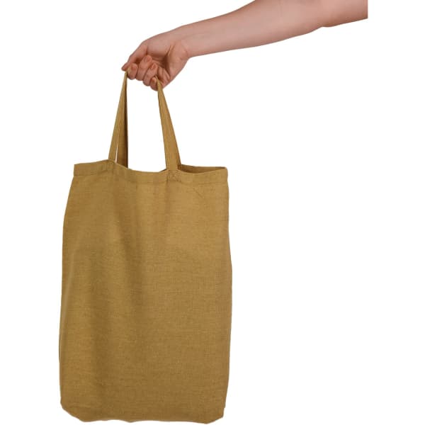 A hand holds a yellow tote bag with short handles, featuring a simple design and a logo.