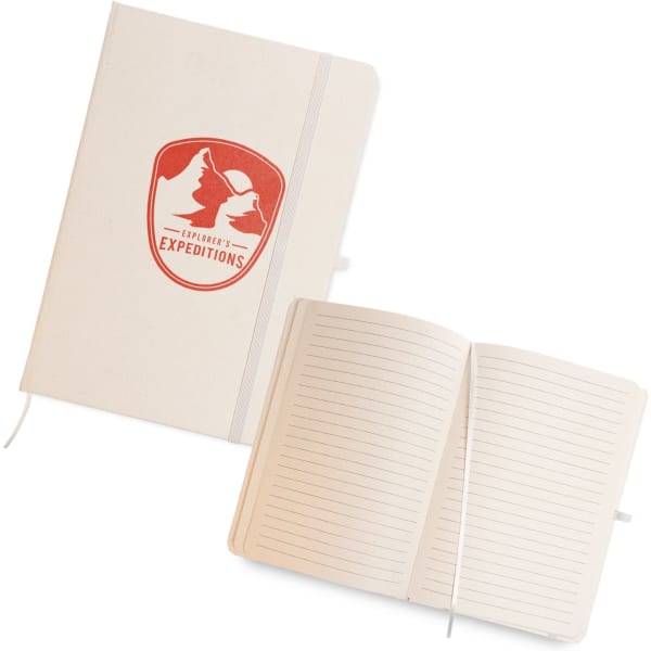 A cream A5 notebook with a logo, featuring lined pages and a ribbon bookmark. The cover has a textured finish.