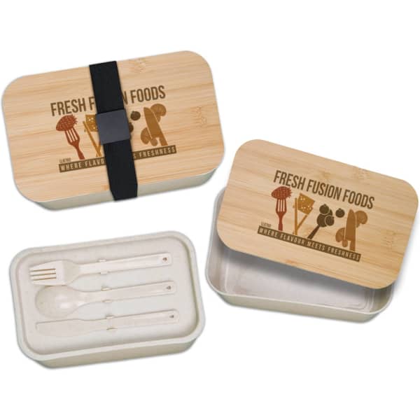 A bamboo lunch box in light brown with a black strap, featuring a removable inner container and utensils.