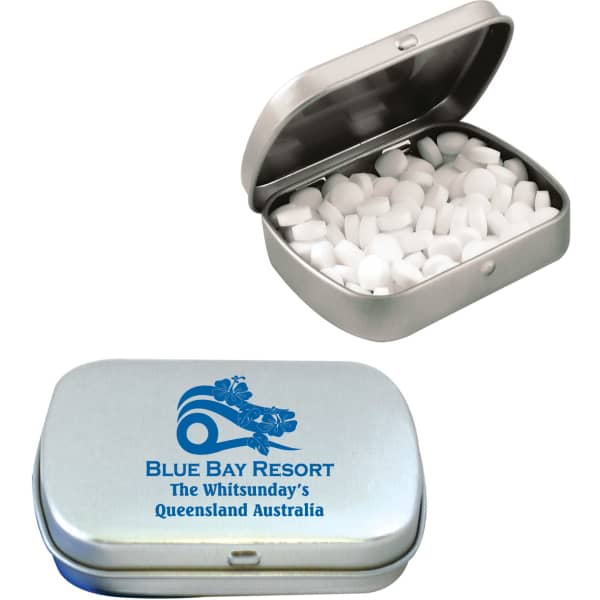 A silver tin containing white sugar-free breath mints, featuring a logo on the lid.
