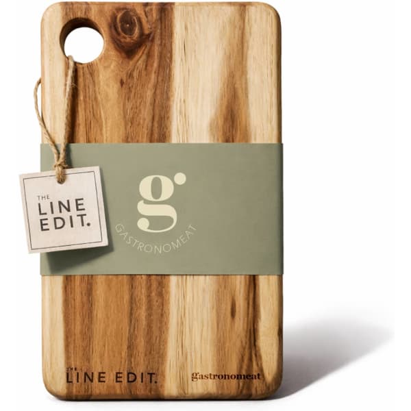 An acacia serving board with a natural wood finish, featuring a tag and a logo, showcasing its elegant design.