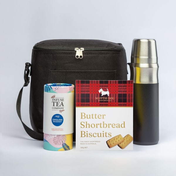 A cooler bag in black with a silver drink bottle and a pack of butter shortbread biscuits.