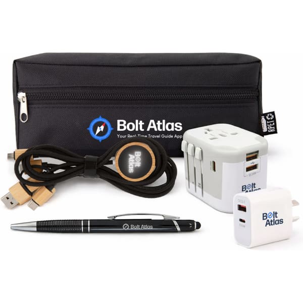 A black zippered pouch contains a pen, charging cables, a travel adapter, and a USB plug, featuring a logo.