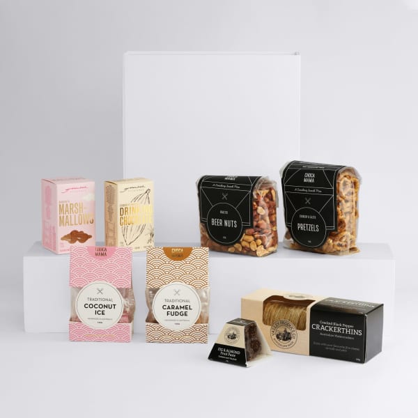 A selection of snacks including marshmallows, drink mix, beer nuts, pretzels, coconut ice, caramel fudge, and crackers, all in various packaging.
