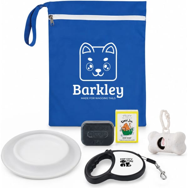 A blue pouch containing a white plate, dog soap, a toy bone, and a dog leash with a logo.