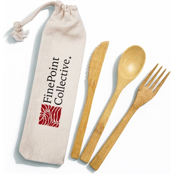 A bamboo cutlery set including a knife, fork, and spoon, presented in a calico pouch. The pouch features a logo.