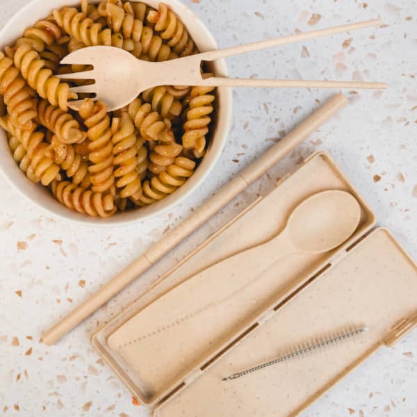 A Ramen Cutlery Set in natural beige, including a fork, spoon, chopsticks, and cleaning brush, in a matching case.