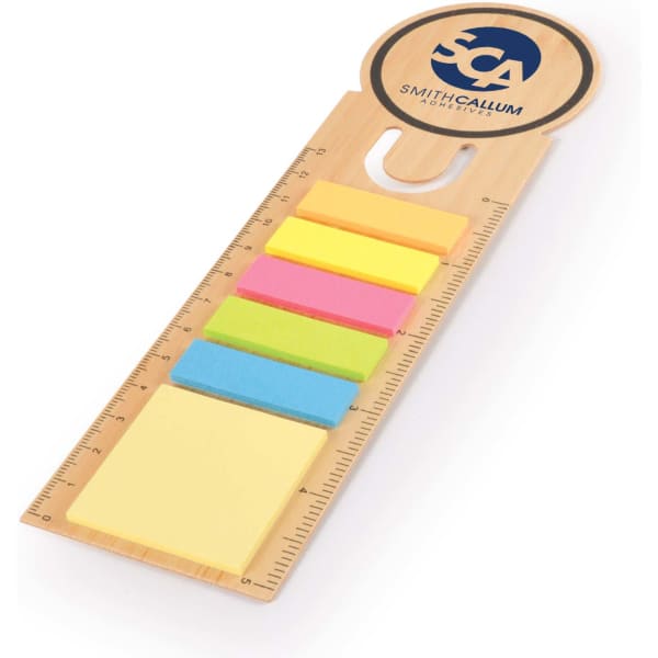 A bamboo bookmark featuring a ruler, with five colourful sticky notes in yellow, pink, green, blue, and orange.