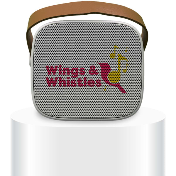 A compact white mini speaker with a brown strap, featuring a logo on the front.
