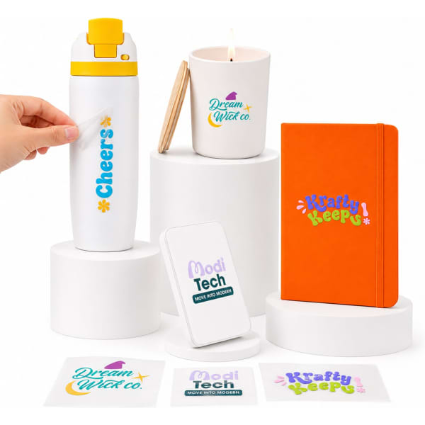 A drink bottle, candle holder, notebook, and various colourful stickers arranged on display stands.