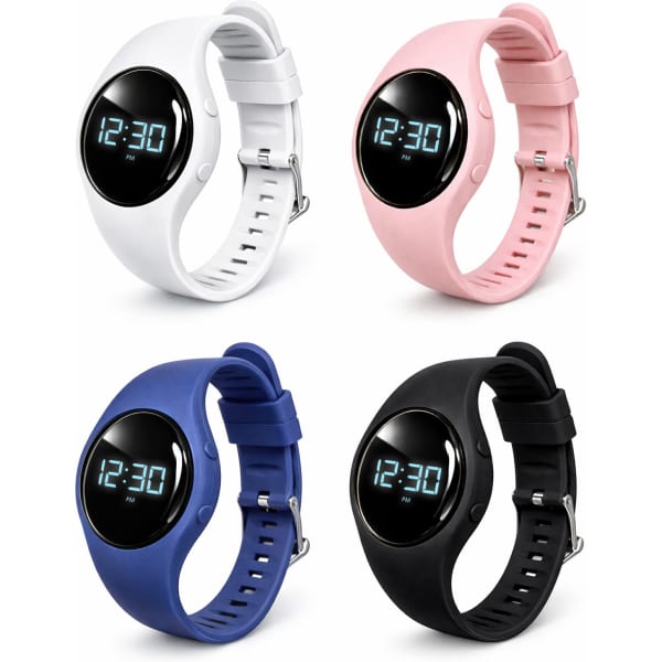 A set of four pedometers in white, pink, blue, and black, each with a digital display and adjustable straps.