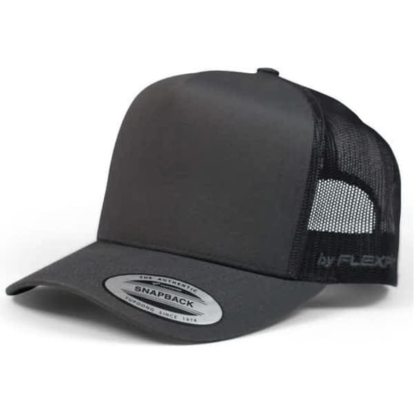 A black Yp Classic 6507 A Trucker Cap with a mesh back and snapback closure, featuring a logo.