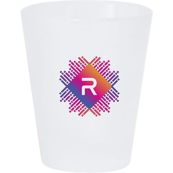 A frosted shot glass featuring a multicoloured geometric design with a logo at the centre.
