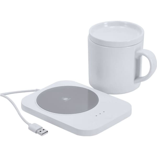 A white cup and a matching white cup warmer with a wireless charger, featuring a USB cable connection.