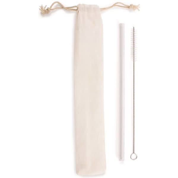 A transparent glass straw and a cleaning brush alongside a natural fabric storage pouch.