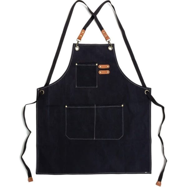 A navy canvas apron with leather straps and decorative stitching, featuring a front pocket and multiple loops.