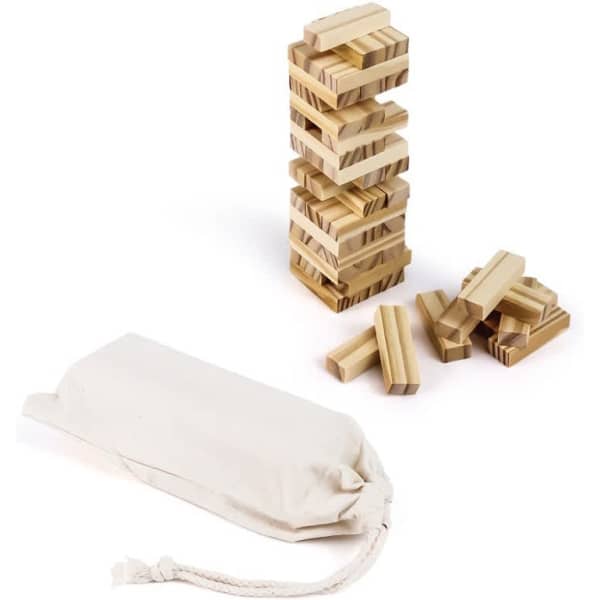 A wooden tumbling tower game with stacked blocks and loose pieces, accompanied by a cream-coloured storage bag.