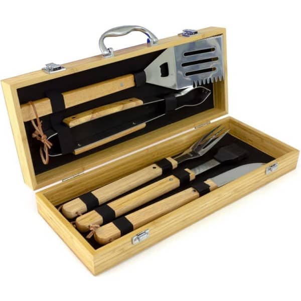 An eco-friendly BBQ set in a wooden case, featuring stainless steel tools with wooden handles. Includes a spatula, fork, and tongs.