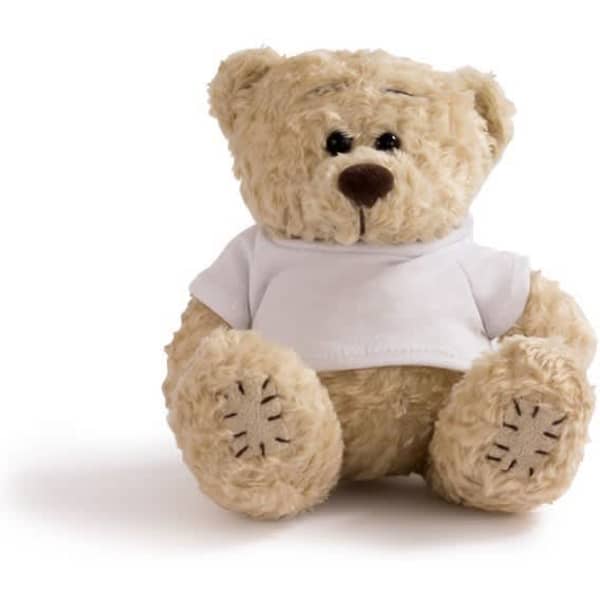 A teddy bear wearing a plain white t-shirt, sitting upright with a soft, plush texture.