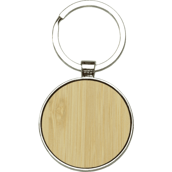Circular keyring made of recycled zinc alloy with a bamboo surface, featuring a metal ring for attachment.