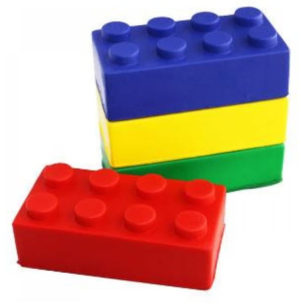 A set of building blocks in red, blue, yellow, and green, featuring circular studs on top.