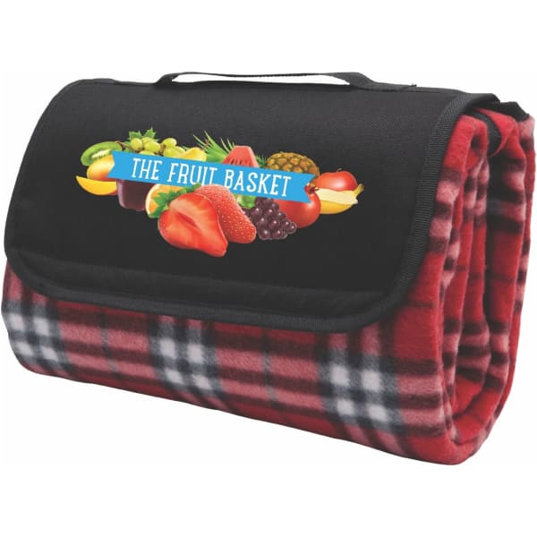 A red check picnic rug with a black flap and a logo of assorted fruits on the front.