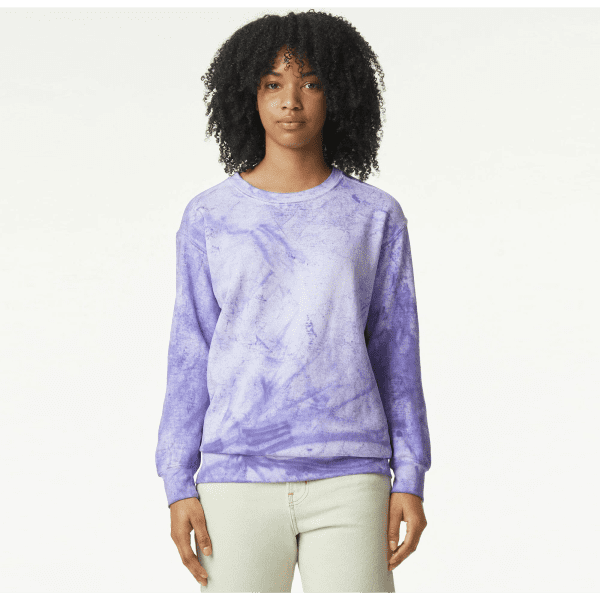 A purple tie-dye crewneck sweatshirt featuring long sleeves and a relaxed fit, with a tag visible.