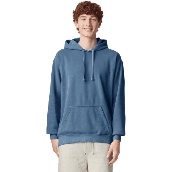 A blue hooded sweatshirt with a front pocket and drawstrings, worn by a model. It features a logo.