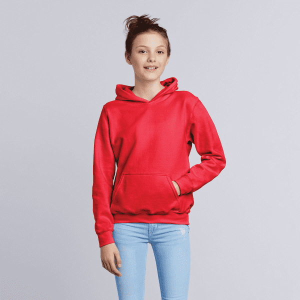 A red youth hooded sweatshirt features a front pocket and an attached hood. The model is wearing light blue jeans.