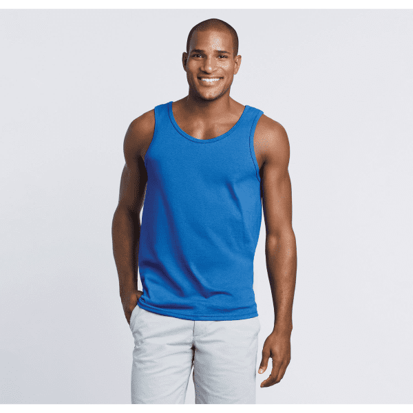 A blue heavy cotton adult singlet worn by a smiling man, featuring a classic scoop neckline and a logo.