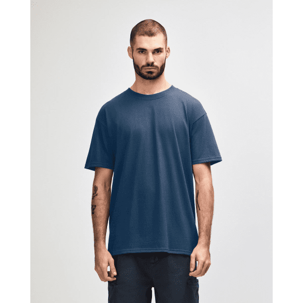 A heavyweight adult T-shirt in navy blue, worn by a model with a neutral expression. The shirt has a simple logo.
