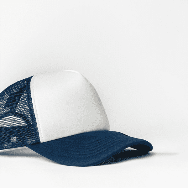 A navy and white trucker cap featuring a mesh back and a front panel with a logo.