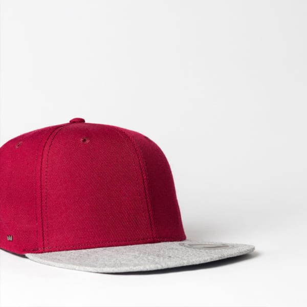 A maroon cap with a grey brim, featuring a logo on the side. Suitable for casual or sporty wear.