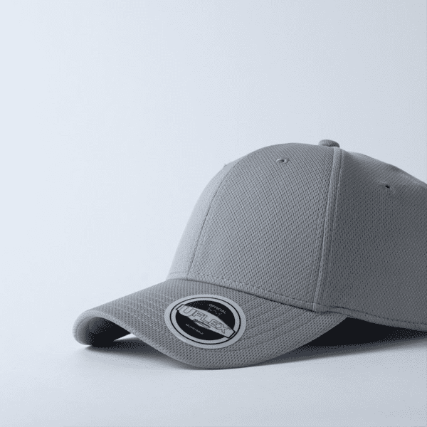A grey recycled polyester cap with a textured surface and a branded logo on the side.